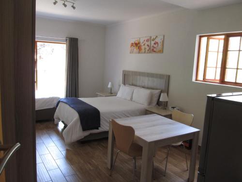 Ένα ή περισσότερα κρεβάτια σε δωμάτιο στο 50 Galena Affordable Luxury