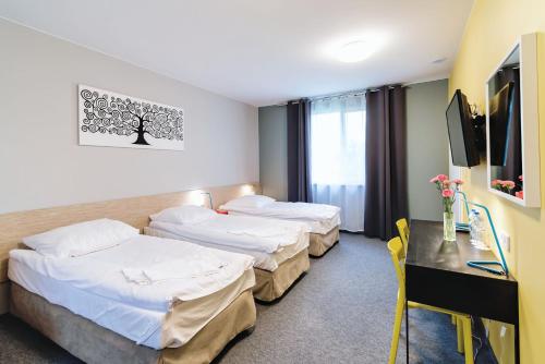 Posteľ alebo postele v izbe v ubytovaní Tamada