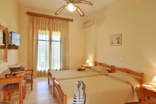 Ένα ή περισσότερα κρεβάτια σε δωμάτιο στο Skafonas Apartments 