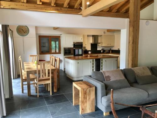 a living room with a couch and a table at Chalet Marmotte 1 in Morzine