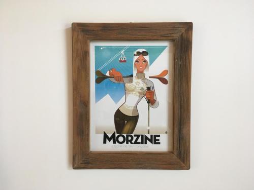 a picture of a woman in a picture frame at Chalet Marmotte 1 in Morzine