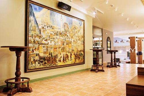 a large painting hanging on a wall in a store at Hot Springs Medical and SPA in Banya