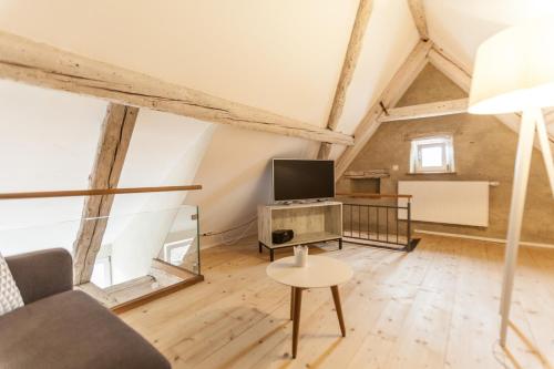 Baumgartners Dreiseithof - historisch, modern, zentralにあるテレビまたはエンターテインメントセンター