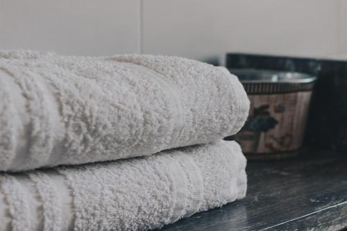a stack of towels sitting on a table at Intorno Firenze B&B in San Piero a Sieve