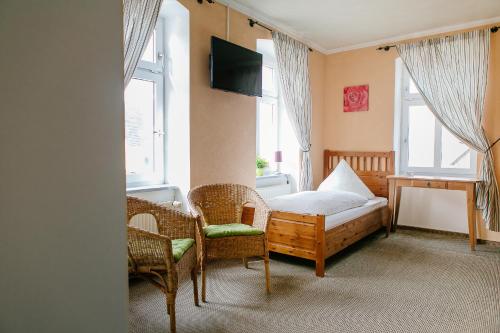 מיטה או מיטות בחדר ב-Landhotel Airport-Inn