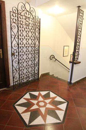 a staircase with a star pattern on the floor at Locanda Miranda in Tellaro