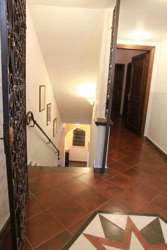 a hallway with a staircase with a star on the floor at Locanda Miranda in Tellaro