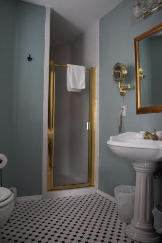a bathroom with a shower and a sink and a toilet at Tandem Bike Inn in Belmar