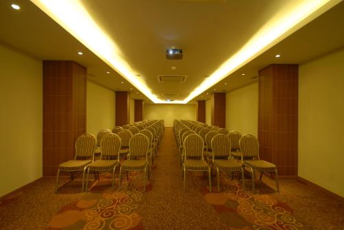 a row of chairs in a room with lights at Suhan Cappadocia Hotel & Spa in Avanos
