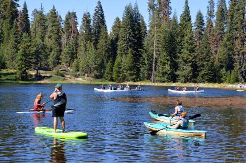 a group of people on kayaks on a lake at Montecito Sequoia Lodge in Sequoia National Park
