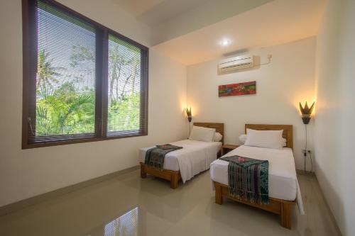 Tempat tidur dalam kamar di Dream Estate Resort