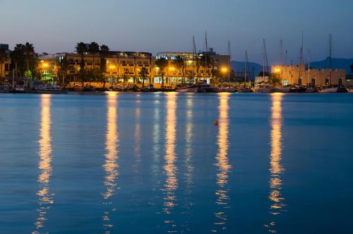 a large body of water with buildings in the background at Kosta Palace in Kos Town