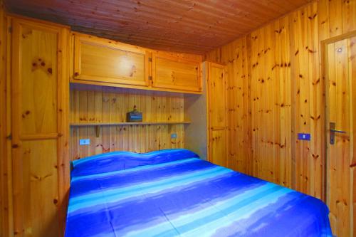 A bed or beds in a room at Campeggio Boscoverde