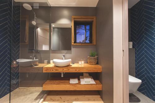 a bathroom with a sink and a toilet at Bukubaki Eco Surf in Ferrel