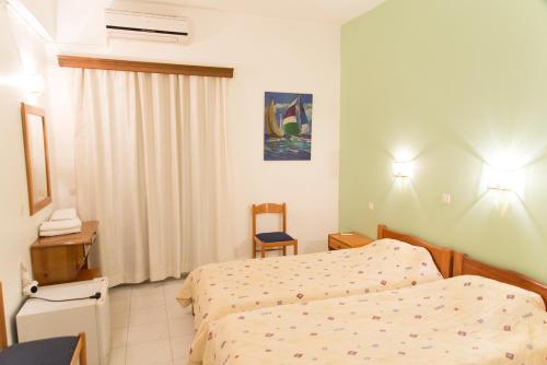 Katil atau katil-katil dalam bilik di Athina Hotel