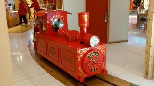 a red toy train is on display in a store at Hitoyoshi Morinohall Ladies in - Female Only in Hitoyoshi