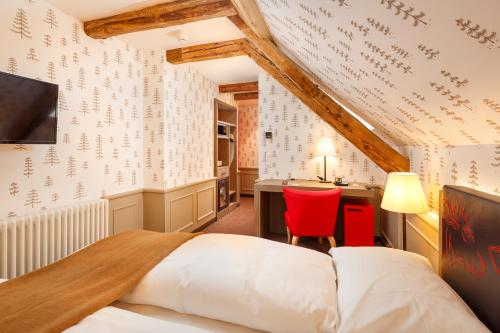 A bed or beds in a room at Swiss Night by Fassbind