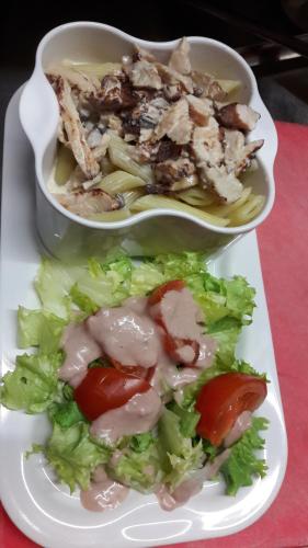 a plate of food with a bowl of chicken and salad at Campanile Nevers Nord - Varennes-Vauzelles in Varennes Vauzelles