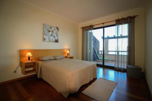 A bed or beds in a room at Paradise Ocean View by AnaLodges