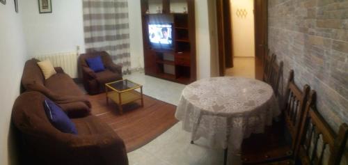 A television and/or entertainment centre at Apartamento Delicia