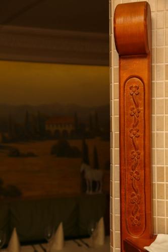 a wooden door on a wall with a picture at Pažaislis Park Hotel in Kaunas