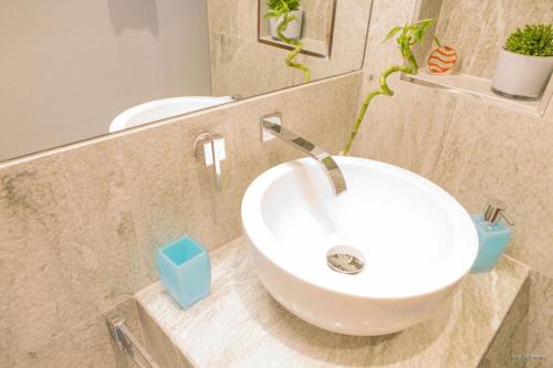 a bathroom with a white sink and a mirror at Ursula Maria in Ischgl