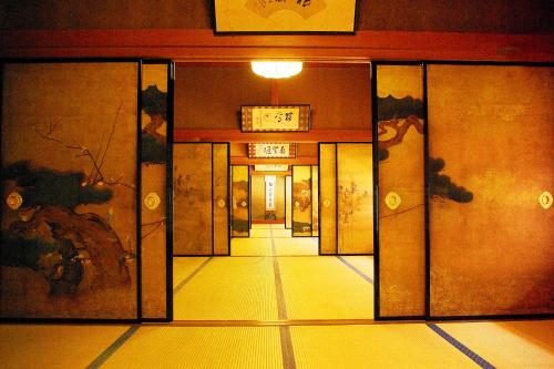 an entrance to a building with a door open at 高野山 宿坊 不動院 -Koyasan Shukubo Fudoin- in Koyasan