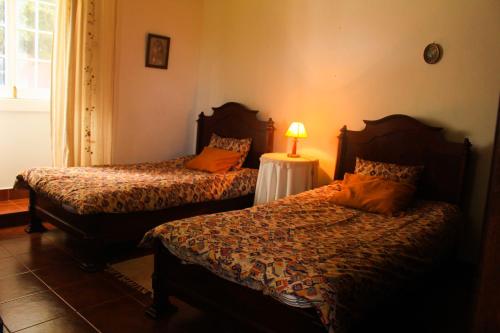 Postel nebo postele na pokoji v ubytování Casa das Lapinhas