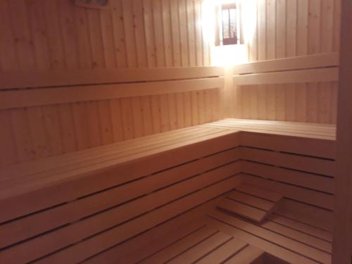 a sauna with a light in the corner at Family Hotel Jemelly in Obzor