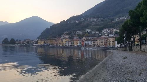 a town next to a body of water with buildings at Casa Contadina in Vercana