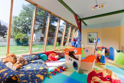 a childs play room with many toys in it at Hotel Truyenhof in Ried im Oberinntal