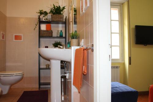 a bathroom with a sink and a toilet at Arches B&B in Rome