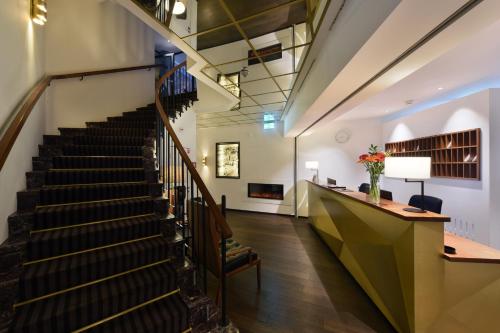 a staircase in a building with a stair case at Hotel City Zürich Design & Lifestyle in Zürich
