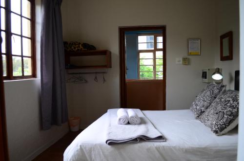 Ένα ή περισσότερα κρεβάτια σε δωμάτιο στο A Sunflower Stop Backpackers