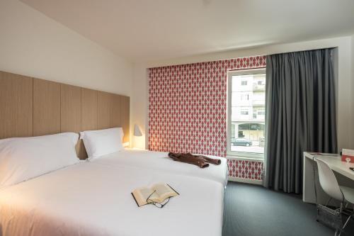 Cama ou camas em um quarto em Stay Hotel Porto Centro Trindade