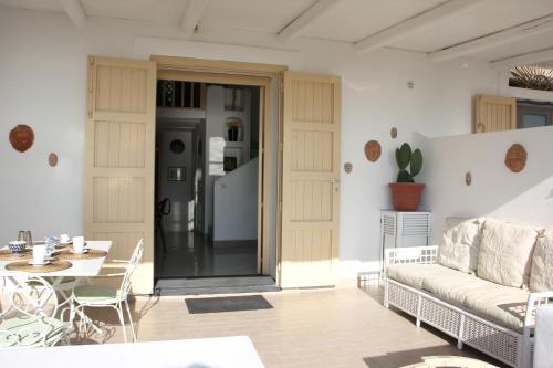 a living room with a couch and a table at Villa Ginestra sulla spiaggia di Stromboli in Stromboli