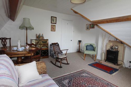 a living room with a couch and a table at Southfield House in Hornsea