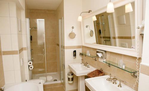 a bathroom with a toilet and a sink and a shower at My Place in Lautzenhausen