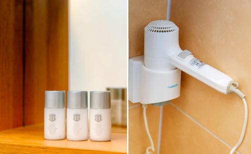 a hair dryer and three bottles of hair products at My Place in Lautzenhausen