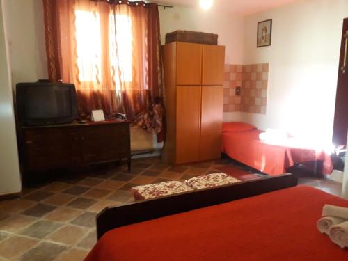 Ένα ή περισσότερα κρεβάτια σε δωμάτιο στο Bed And Breakfast Delle Grotte
