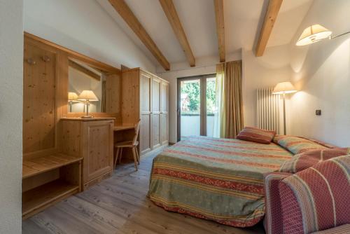 Postel nebo postele na pokoji v ubytování Hotel Regent's