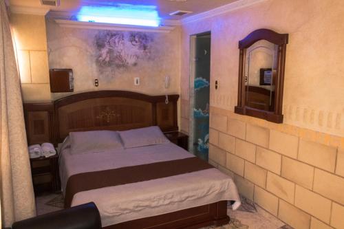 Voodi või voodid majutusasutuse Motel Piramides De Cristal toas