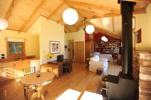 a living room with a couch and a table at Mumfords in Akaroa