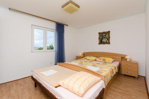 Llit o llits en una habitació de Apartment Stojna