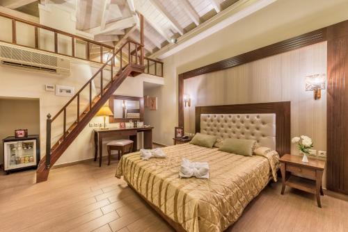 a bedroom with a large bed and a staircase at Theofilos Paradise Boutique Hotel in Mytilini