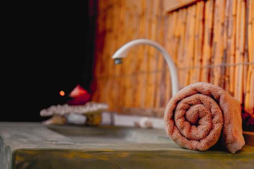 a towel sitting on a counter next to a sink at Sandy Edge in Kalpitiya