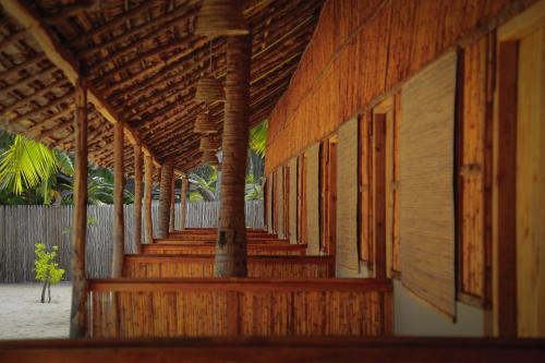 a row of wooden stairs on a building at Sandy Edge in Kalpitiya