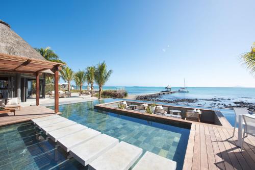 an infinity pool with a view of the ocean at Veranda Paul et Virginie Hotel & Spa - Adults Only in Grand Gaube