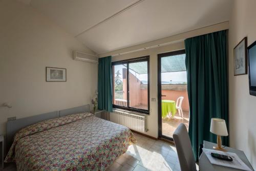 Postel nebo postele na pokoji v ubytování Hotel Le Tre Isole