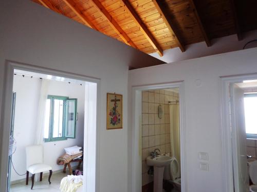 a bathroom with a toilet and a sink at Sea front Villas Danezis in Symi